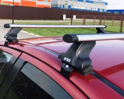 Как подобрать багажник на гладкую крышу автомобиля